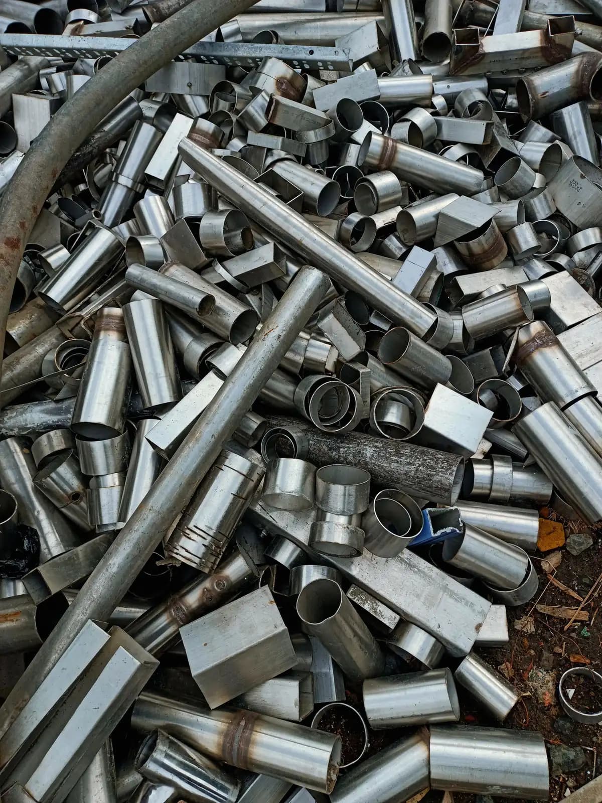 A heap of cut metal pipes and tubes sorted as scrap